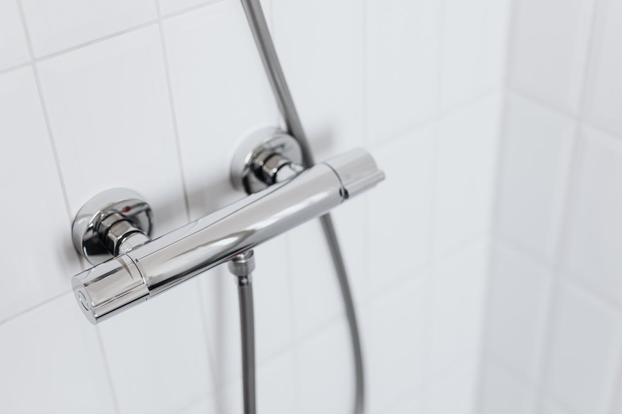 Stainless Steel Pipe on Ceramic Wall